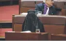  ??  ?? RELEVANT: Senator Pauline Hanson wearing a burqa in the Senate.