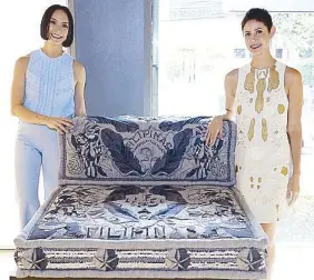  ??  ?? Bea and Marga Valdes with their denim sofa inspired by old postcards and Filipino symbols.