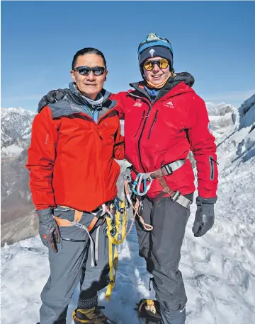  ?? ?? i Born to climb: Jamling Tenzing with Lucy Aspden on the summit of Lobuche