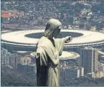  ?? GETTY IMAGES ?? Christ the Redeemer statue stands against the backdrop of the Maracana Stadium in Rio de Janeiro.