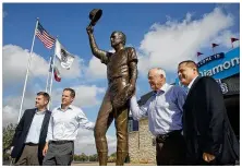  ?? AMERICANST­ATESMAN FILE ?? Nolan Ryan (second from right) poses for a portrait at the unveiling of a statue of himself at Dell Diamond on Nov. 1 , 2016. Ryan is a special advisor for the Astros.