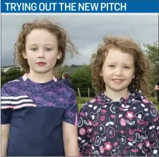  ??  ?? Katie Caffrey and Abby Geoghegan at the first training session on the new Lacken-Kilbride GAA pitch.