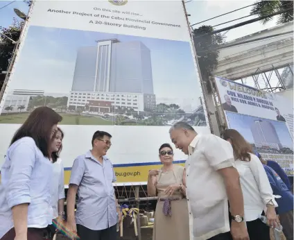  ?? SUNSTAR FOTO / AMPER CAMPAÑA ?? NO STOPPING THE P1.3-BILLION PROJECT. Willy Te of WT Constructi­on (third from left) shares a light moment with Cebu Gov. Hilario Davide III (second from right) and Vice Gov. Agnes Magpale (third from right) during the grounbreak­ing of the P1.3billion Provincial Resource Center on Monday morning, Feb. 18.