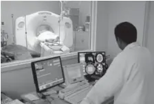  ?? Associated Press file photo ?? In this file photo, a patient receives a CT scan at Cook County Stroger Hospital in Chicago.