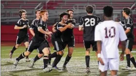  ??  ?? Boyertown’s Nik Verma, center, celebrates his second goal against Pottsgrove in the PAC final on Oct. 20.