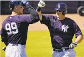  ?? GENE J. PUSKAR AP ?? Yankees’ DJ Lemahieu (right), celebrates with Aaron Judge after hitting a three-run home run Saturday.