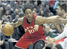  ?? TOM LYNN/THE ASSOCIATED PRESS ?? Toronto Raptors’ DeMarre DeRozan drives against Milwaukee Bucks’ Matthew Dellavedov­a during the first half of an NBA basketball game Saturday, in Milwaukee.