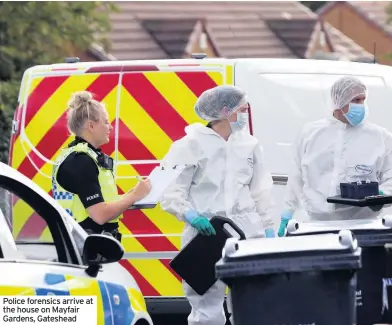  ??  ?? Police forensics arrive at the house on Mayfair Gardens, Gateshead