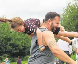  ?? 13797121 ?? Stephen Terry playfully swings his daughter Savannah, aged eight, over his shoulders