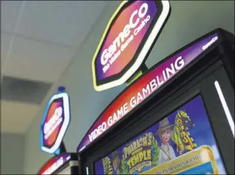  ??  ?? GameCo is the first U.S. company to manufactur­e VGMs, or video game gambling machines, which combine skill with gambling.