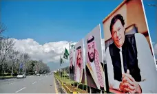  ??  ?? Pakistani commuters ride past billboards showing portraits of Saudi Arabian Crown Prince Mohammed bin Salman (2R) and Pakistan's PM Imran Khan (R) displayed on a roadside ahead of the prince's arrival in Islamabad. Pakistan is preparing to welcome the Crown Prince for a state visit over Feb 16-17, as Islamabad hopes to sign various investment deals to prop up its slumping economy. (Photo by AAMIR QURESHI / AFP)