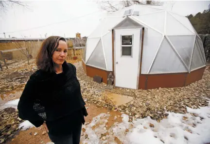  ?? LUIS SÁNCHEZ SATURNO/THE NEW MEXICAN ?? Though the City Council decided Wednesday night that Iscah Carey can keep her fence, Carey said Thursday she is disappoint­ed by the governing body’s decision that she must tear down her greenhouse.