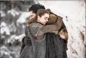  ?? Helen Sloan HBO ?? A RYA (Maisie Williams) hugs Jon (Kit Harington) after traumatic years apart on “Game of Thrones.”