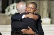  ?? PABLO MARTINEZ MONSIVAIS — THE ASSOCIATED PRESS ?? President Barack Obama hugs Vice President Joe Biden after delivering the eulogy in honor of Biden’s son, former Delaware Attorney General Beau Biden, Saturday at St. Anthony of Padua Church in Wilmington, Del. Biden, Vice President Biden’s eldest son,...