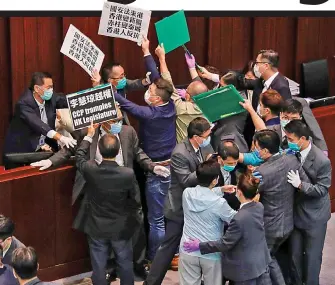  ??  ?? Law: Pro-democracy politician­s protesting in Hong Kong yesterday