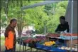  ?? LEAH MCDONALD — ONEIDA DAILY DISPATCH ?? A man looks over local produce at the Cottage Lawn Farmers Market at the Madison County Historical Society on Tuesday, June 5, 2018. The market will host Taste of Oneida on Tuesday, June 19, 2018, from 3-7p.m.