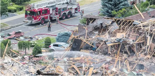 ?? MARK BLINCH / THE CANADIAN PRESS ?? Robert Nadler and his wife Dianne Page were found dead in the wreckage of a massive house explosion in Mississaug­a, Ont. The cause of the blast is still under investigat­ion.
