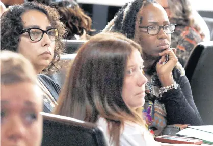  ?? JOHN SMIERCIAK/POST-TRIBUNE PHOTOS ?? Denisha Balfour, right, reacts as she and other women watch a short video about Gabby Petito, a young woman recently found dead. The women were attending a domestic violence panel luncheon hosted by Geminus at Gamba Ristorante on Wednesday.