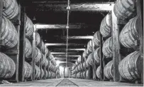  ??  ?? Barrels of whiskey are being aged in one of the barrel warehouses at the Jack Daniel Distillery in Lynchburg, Tenn. This barrel warehouse holds more than 1 million gallons of whiskey.