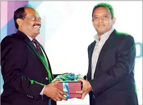  ??  ?? Vice Chancellor of NSBM Dr. E. A. Weerasingh­e presenting a commemorat­ive gift to the Hon. Chandima Weerakkody – Minister of Skills Developmen­t and Vocational Training