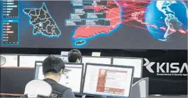  ?? Yonhap AFP/Getty Images ?? WANNACRY has seized about 300,000 computers in the last week. Above, the Korea Internet and Security Agency in Seoul monitors ransomware attacks.