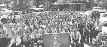  ??  ?? Awangku Ali Udin (seated third right) with the scouts after completing the programme.