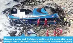  ?? — AFP ?? Rescuers, police and firefighte­rs working at the scene after a bus plunged over a cliff after colliding with a truck on a coastal highway near Pasamayo on Tuesday.