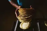  ?? Associated Press ?? A worker packages tortillas to sell for 20 Mexican pesos per kilogram, about one dollar, at a tortilla factory in Mexico City on May 9. Almost a year ago, the same tortilla factory used to sell a kilo of tortillas for 10 Mexican pesos.