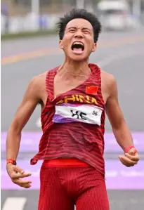  ?? WILLIAM WEST/AGENCE FRANCE-PRESSE ?? HE Jie is in hot water after posting an ‘embarrassi­ng’ win in a half-marathon event in Beijing.
