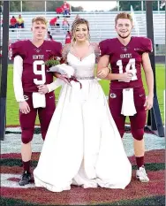  ?? Westside Eagle Observer/RANDY MOLL ?? Senior maid Whitly Cochran is escorted by seniors Ayden Smartt and Dylan Rayburn at homecoming ceremonies at Gentry High School.