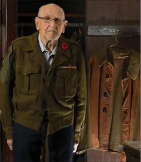  ?? JON WELLS PHOTOGRAPH BY BARRY GRAY, THE HAMILTON SPECTATOR ?? Morley Balinson wears his wool uniform from the Korean War. In the background is a jacket called a jerkin that had belonged to his brother, Robert, who served as a medical officer in the Second World War. Morley wore that jacket frequently in Korea.