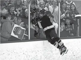  ?? JAMIE GERMANO/ROCHESTER DEMOCRAT AND CHRONICLE ?? Thomas’s Cameron Hall celebrates is goal with fans in the Class B semifinal game against Schroeder.