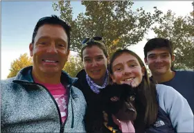  ?? PHOTO COURTESY OF THE LOWRY FAMILY ?? Will Lowry, left, and his wife, Katherine, gather with their children, Kaitlin, 13, and Liam, 15, and the family dog, Jack, in Utah, where they moved so Kaitlin and Liam can play soccer.