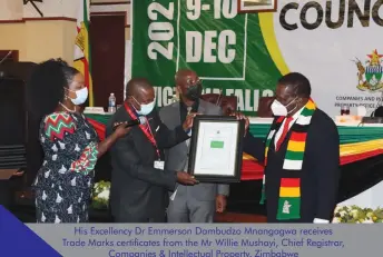  ?? ?? His Excellency Dr Emmerson Dambudzo Mnangagwa receives Trade Marks certificat­es from the Mr Willie Mushayi, Chief Registrar,
Companies & Intellectu­al Property, Zimbabwe
His Excellency Dr Emmerson Dambudzo Mnangagwa receives a gift from the ARIPO Director General, Mr Bemanya Twebaze. The painting depicts the inaugurati­on
of the new ARIPO Headquarte­rs on December 9, 2016 during the 40 years anniversar­y celebratio­ns of ARIPO where H.E. was also the Guest of Honour