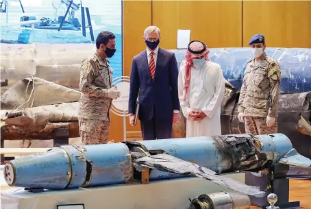  ?? Reuters ?? Minister of State for Foreign Affairs Adel Al-Jubeir and US envoy Brian Hook check the display of the debris of ballistic missiles and weapons in Riyadh.