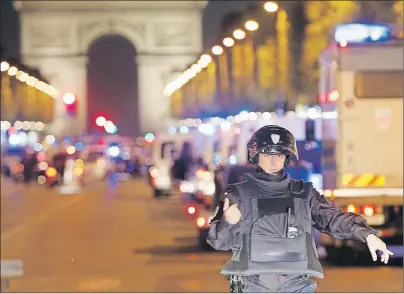  ?? AP PHOTO ?? Police seal off the Champs Elysees in Paris, France, after a fatal shooting in which a police officer was killed along with an attacker, Thursday.
