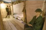  ??  ?? Above right: A life-size model of a Second World War trench, part of the pop-up museum. Above left: Johannes and Caterina van Roon, who hid Ralph Berets and his sister Marion. Left: Matthew Lang in the Anne Frank room of the pop-up museum. Lang tracked...