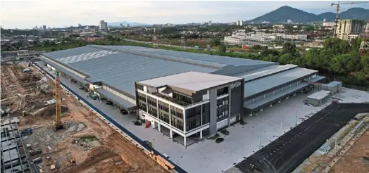  ?? ?? SIBS’ second plant opens today at the Penang Science Park in Bukit Minyak. (Below) The company’s parameteri­sed modularisa­tion housing works in progress in Sweden.