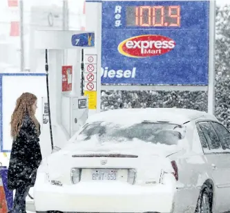  ?? CLIFFORD SKARSTEDT/EXAMINER FILES ?? A driver pumps gas at an Ultramar gas station on Lansdowne St. W. on Dec. 11, 2014. NDP-drafted legislatio­n to regulate gasoline prices in Ontario was defeated at Queen’s Park on Monday.