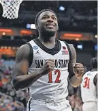  ?? JAMIE RHODES/ USA TODAY SPORTS ?? San Diego State guard Darrion Trammell sank a free throw shot for the final, winning point of Sunday’s game.