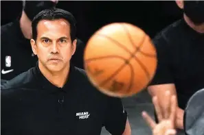  ?? AP Photo/Morry Gash ?? ■ Miami Heat head coach Erik Spoelstra watches a shot during the first half of Game 1 of their NBA first-round playoff series against the Milwaukee Bucks on Saturday in Milwaukee.