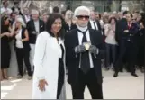  ?? THIBAULT CAMUS, THE ASSOCIATED PRESS ?? Paris Mayor Anne Hidalgo with fashion designer Karl Lagerfeld after presenting him with the Grand Vermeil medal.