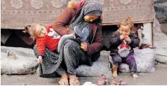  ?? | Reuters ?? DISPLACED Palestinia­ns, who fled their houses due to Israeli strikes, sit amid the ongoing conflict between Israel and Hamas, in Rafah in the southern Gaza Strip, yesterday.