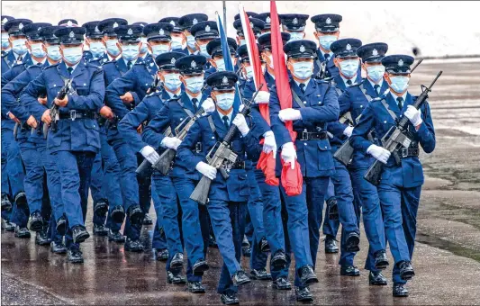  ?? Photo: AFP ?? Police officers perform a new goose step, the same style used by police and troops on the Chinese mainland, at the city’s police college before hoisting the Chinese national flag and HKSAR flag during an open day to celebrate the National Security Education Day in Hong Kong on Thursday ( See story on Page 4).