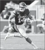  ?? NWA Democrat-Gazette/CHARLIE KAIJO ?? Arkansas Razorbacks tight end Chase Harrell runs the ball Saturday against Portland State at Donald W. Reynolds Razorback Stadium in Fayettevil­le.