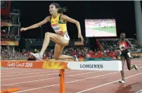  ?? — AFP ?? Jamaica’s Aisha Praught (left) clears a barrier ahead of Kenya’s Celliphine Chepteek Chespol in the women’s 3000m steeplecha­se final on Wednesday.