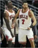  ?? PAUL BEATY — THE ASSOCIATED PRESS ?? Chicago’s Michael Carter-Williams (7) and Bobby Portis (5) celebrate after teammate Jimmy Butler made two free throws to put the Bulls ahead 104-103 with 0:9 seconds left against the Celtics on Thursday in Chicago.