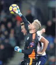  ?? CARL RECINE / ACTION IMAGES VIA REUTERS ?? Leicester City goalkeeper Kasper Schmeichel punches the ball away from Tottenham’s Harry Kane during Tuesday’s match at King Power Stadium in Leicester. The home side won 2-1.