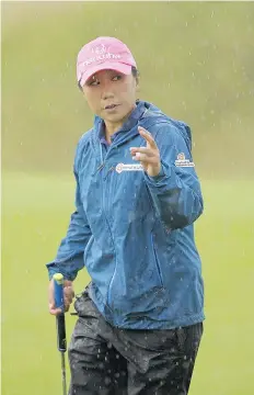  ?? ANDY BUCHANAN/AFP/GETTY IMAGES ?? I.K. Kim sits first after two rounds of the Women’s British Open Golf Championsh­ip in St. Andrews, Scotland.