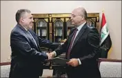  ?? Iraqi Presidency Media Office ?? IRAQ’S prime minister-designate Mohammed Allawi, left, with President Barham Salih in Baghdad.
